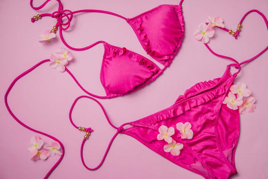 Vibrant pink bikini set adorned with flowers, perfect for trendy lingerie collections in 2025.